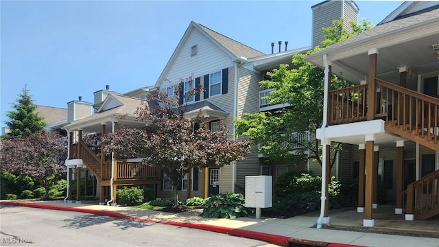 28360 Center Ridge Rd Unit 218, Westlake, OH 44145 - view of property exterior featuring a chimney and stairway