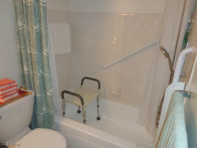 16395 Heather Ln Unit 201, Middleburg Heights, OH 44130 - bathroom featuring shower / bathtub combination with curtain and toilet