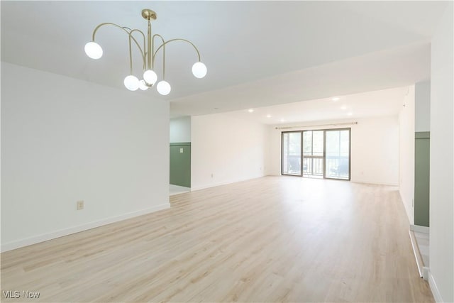 100 Fox Hollow Dr Unit 302, Mayfield Heights, OH 44124 - empty room featuring a chandelier, light wood-type flooring, baseboards, and recessed lighting