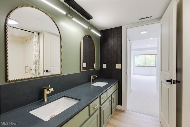100 Fox Hollow Dr Unit 302, Mayfield Heights, OH 44124 - bathroom with double vanity and wood finished floors