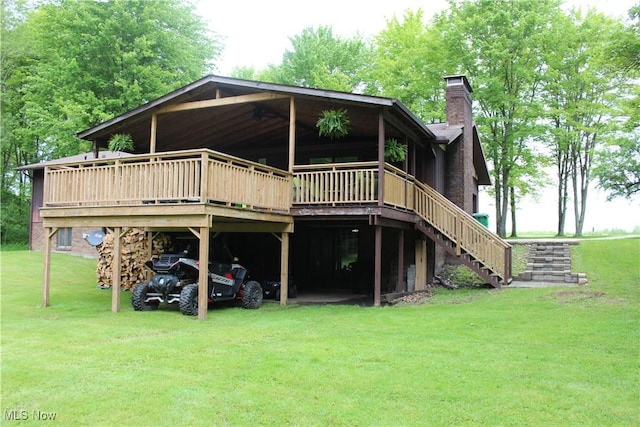 666 E Windsor Rd, Orwell, OH 44076 - rear view of house with a chimney, a lawn, a deck, and stairway
