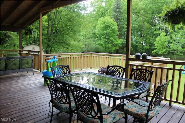 666 E Windsor Rd, Orwell, OH 44076 - deck featuring outdoor dining area and a forest view