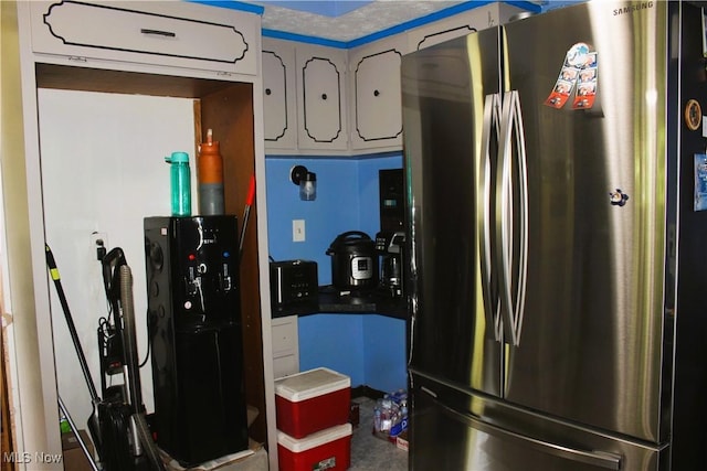 666 E Windsor Rd, Orwell, OH 44076 - kitchen with freestanding refrigerator and white cabinetry