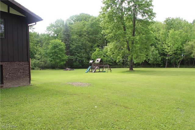 666 E Windsor Rd, Orwell, OH 44076 - view of green lawn with a playground