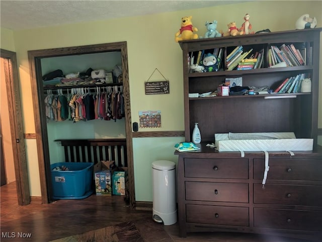666 E Windsor Rd, Orwell, OH 44076 - bedroom featuring a closet and dark wood-type flooring
