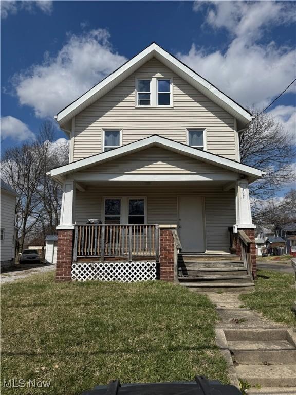 397 Cole Ave, Akron, OH 44301 - american foursquare style home with a porch and a front lawn