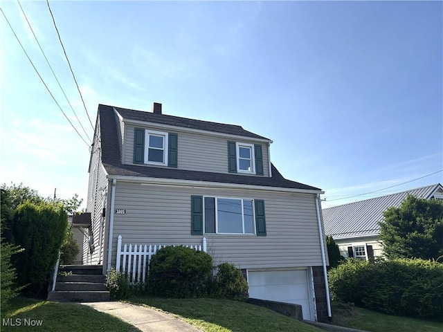 3805 Marlamont Way, Weirton, WV 26062 - view of front facade featuring an attached garage, a front yard, and a chimney