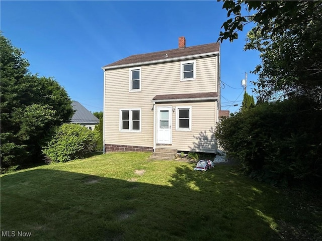 3805 Marlamont Way, Weirton, WV 26062 - back of house featuring a chimney, a yard, and entry steps