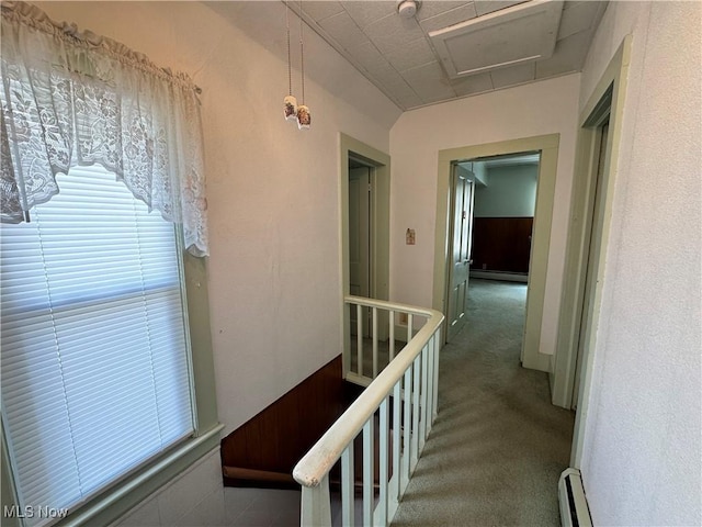 99 W Martin St, East Palestine, OH 44413 - hall featuring an upstairs landing, a baseboard heating unit, plenty of natural light, and carpet flooring