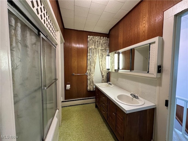 99 W Martin St, East Palestine, OH 44413 - bathroom featuring a baseboard radiator, wooden walls, and double vanity