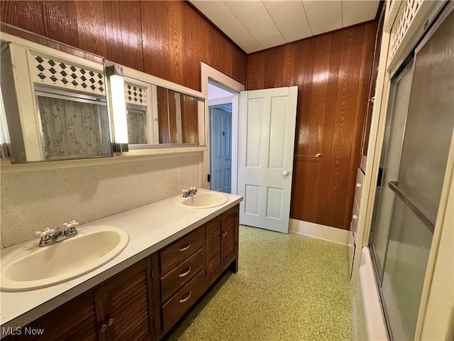 99 W Martin St, East Palestine, OH 44413 - bathroom featuring wood walls, double vanity, and a bathtub