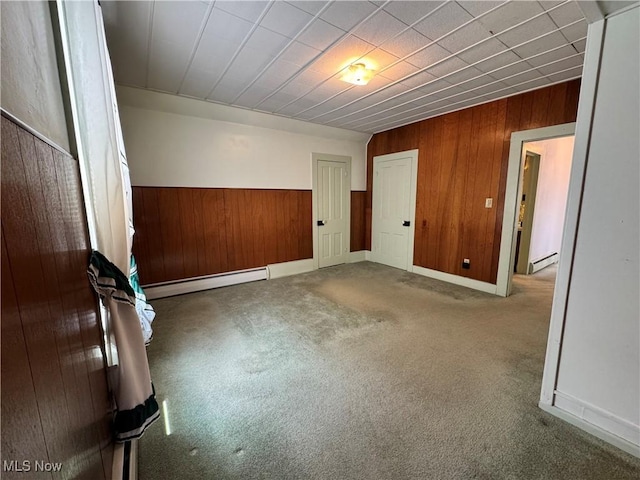 99 W Martin St, East Palestine, OH 44413 - carpeted spare room with baseboard heating, wood walls, and a wainscoted wall