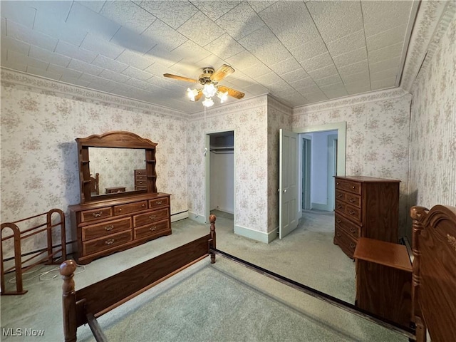 99 W Martin St, East Palestine, OH 44413 - bedroom with wallpapered walls, baseboard heating, a ceiling fan, carpet floors, and a closet
