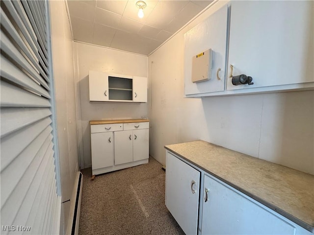 99 W Martin St, East Palestine, OH 44413 - kitchen with baseboard heating, carpet floors, and light countertops