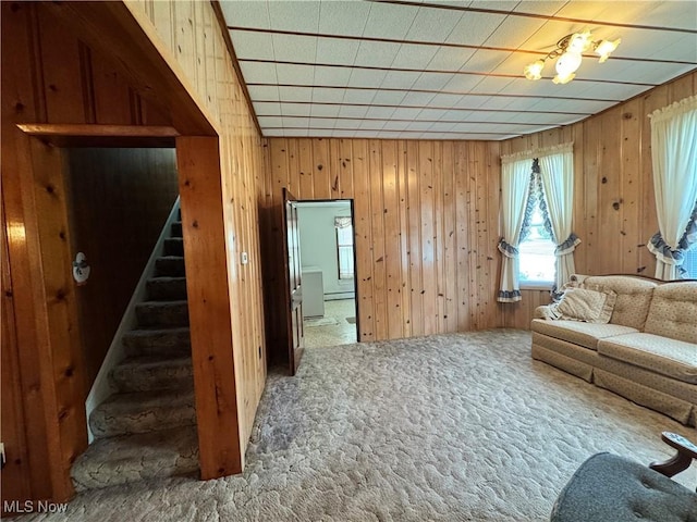 99 W Martin St, East Palestine, OH 44413 - carpeted living area featuring stairway and wooden walls