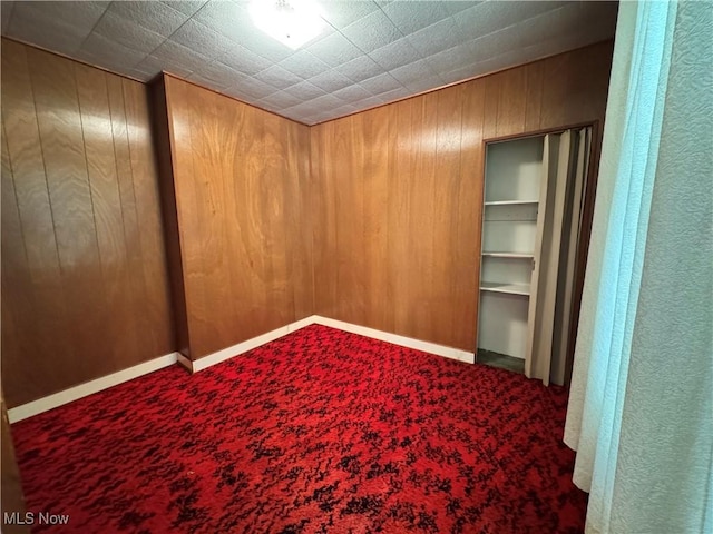 99 W Martin St, East Palestine, OH 44413 - carpeted spare room featuring wood walls