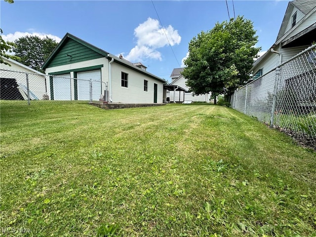 99 W Martin St, East Palestine, OH 44413 - view of yard featuring a garage