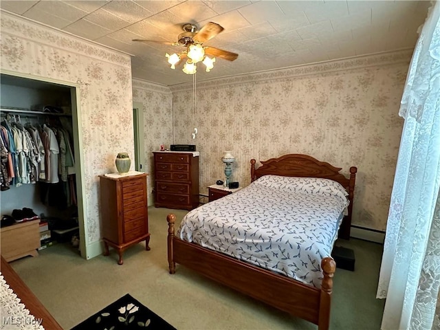 99 W Martin St, East Palestine, OH 44413 - bedroom featuring a baseboard heating unit, carpet, wallpapered walls, a closet, and a ceiling fan