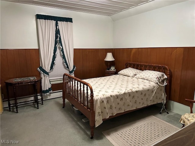 99 W Martin St, East Palestine, OH 44413 - carpeted bedroom featuring a wainscoted wall, wooden walls, and a baseboard radiator