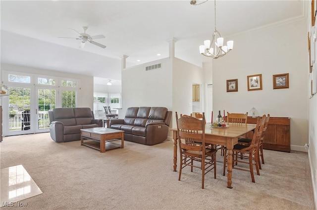 1983 Fox Trace Trl, Cuyahoga Falls, OH 44223 - dining space with light carpet, a ceiling fan, a chandelier, ornamental molding, and a towering ceiling