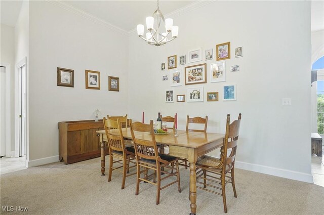 1983 Fox Trace Trl, Cuyahoga Falls, OH 44223 - dining area with a chandelier, baseboards, ornamental molding, light carpet, and a towering ceiling