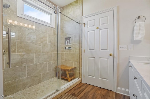 1983 Fox Trace Trl, Cuyahoga Falls, OH 44223 - bathroom featuring a shower stall, vanity, wood finished floors, and baseboards
