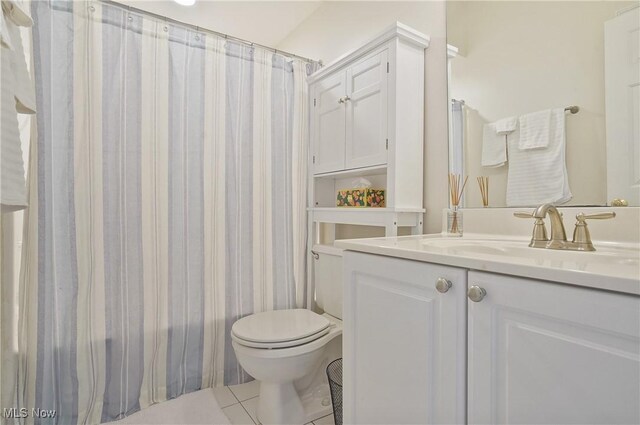 1983 Fox Trace Trl, Cuyahoga Falls, OH 44223 - bathroom featuring vanity, tile patterned floors, toilet, and shower / bath combo with shower curtain