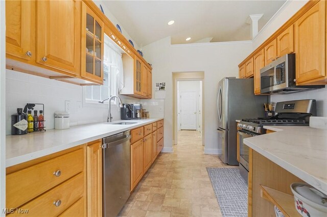 1983 Fox Trace Trl, Cuyahoga Falls, OH 44223 - kitchen with stainless steel appliances, a sink, tasteful backsplash, glass insert cabinets, and recessed lighting