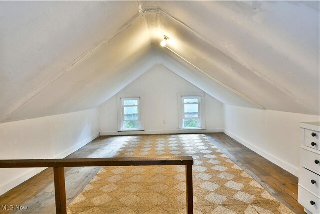 3053 E Market St, Warren, OH 44483 - bonus room with hardwood / wood-style flooring, lofted ceiling, and baseboards