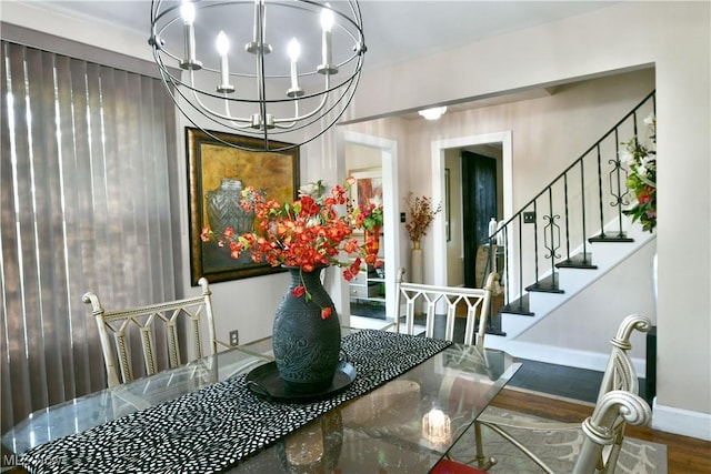 3053 E Market St, Warren, OH 44483 - dining area featuring a chandelier, stairs, wood finished floors, and baseboards