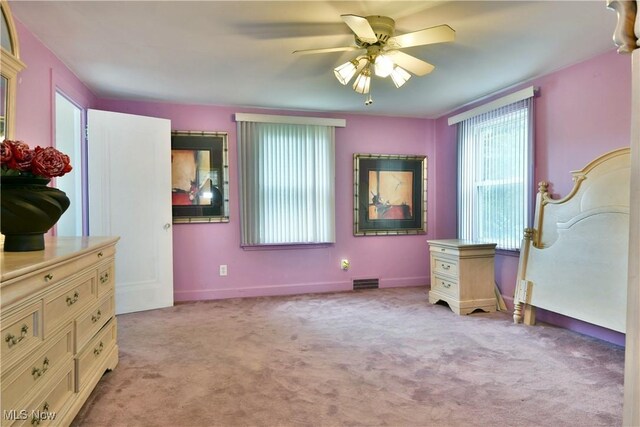 3053 E Market St, Warren, OH 44483 - bedroom with light carpet, baseboards, and a ceiling fan