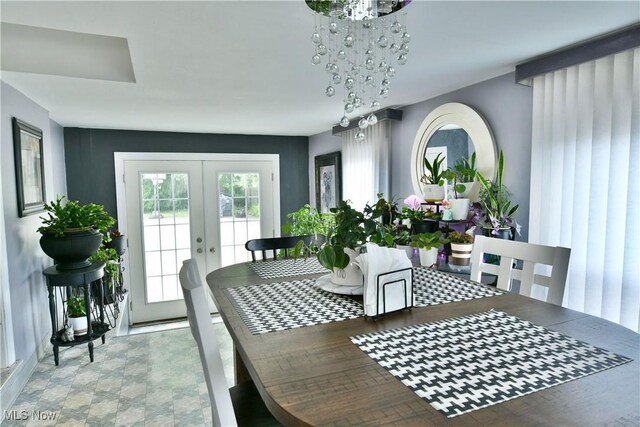 3053 E Market St, Warren, OH 44483 - dining space with french doors and a chandelier
