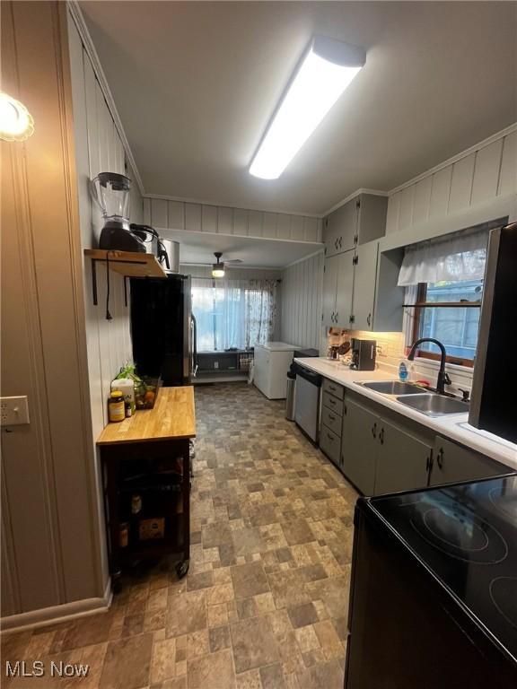 803 N 7th St, Cambridge, OH 43725 - kitchen with a sink, electric range, stainless steel dishwasher, gray cabinetry, and stone finish flooring