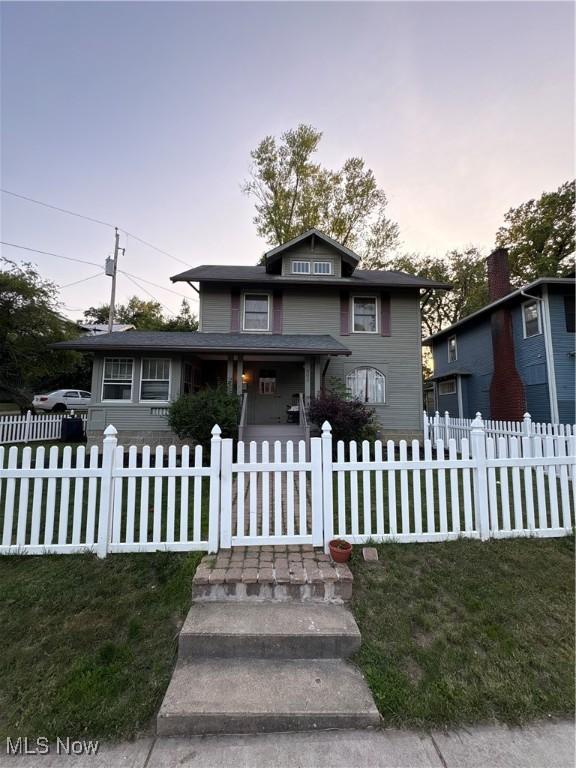 803 N 7th St, Cambridge, OH 43725 - view of front of property featuring a fenced front yard and a porch