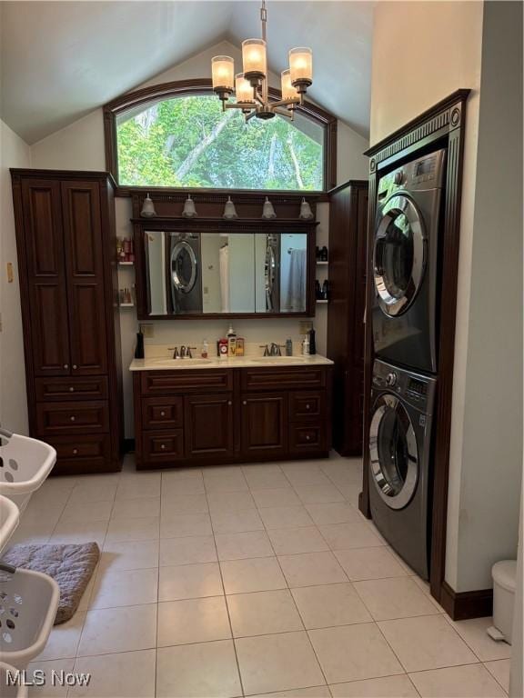 803 N 7th St, Cambridge, OH 43725 - bathroom with stacked washing machine and dryer, lofted ceiling, a bidet, a chandelier, and vanity