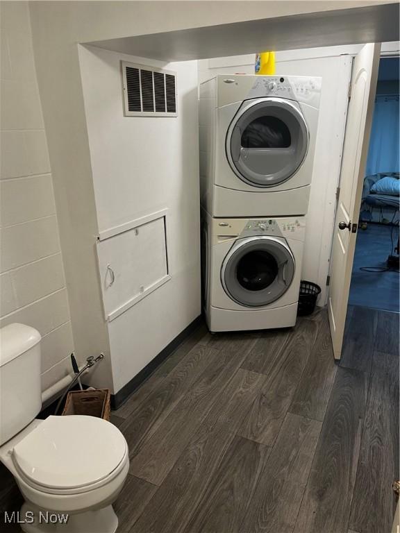 803 N 7th St, Cambridge, OH 43725 - washroom featuring stacked washer / dryer and dark wood-style flooring
