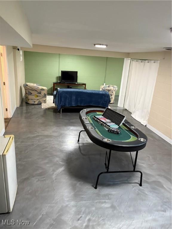 803 N 7th St, Cambridge, OH 43725 - game room featuring concrete flooring and concrete block wall