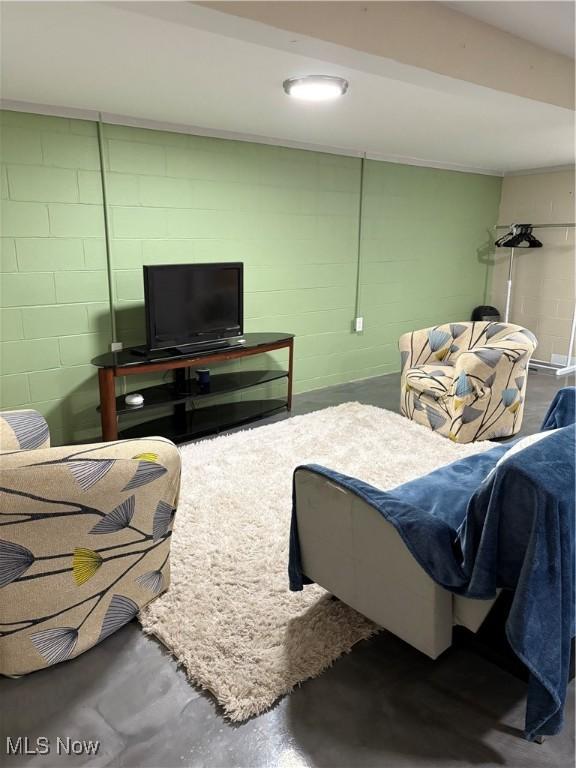 803 N 7th St, Cambridge, OH 43725 - bedroom featuring concrete block wall and concrete flooring