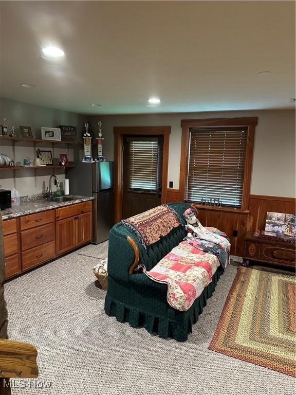 51001 Run Rd, Beallsville, OH 43716 - bedroom with freestanding refrigerator, light colored carpet, wainscoting, wet bar, and wood walls
