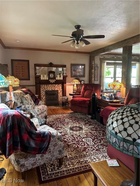 51001 Run Rd, Beallsville, OH 43716 - living room with a ceiling fan, a fireplace, ornamental molding, and wood finished floors