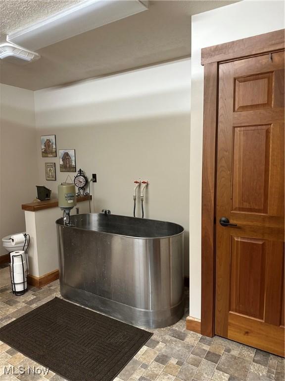 51001 Run Rd, Beallsville, OH 43716 - bar featuring light stone finish flooring and baseboards