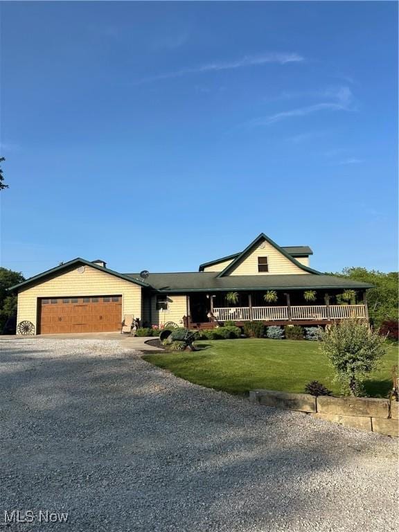 51001 Run Rd, Beallsville, OH 43716 - view of front of home featuring driveway, an attached garage, and a front yard
