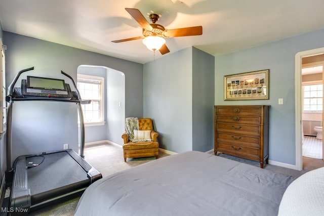 2500 Eaton Rd, University Heights, OH 44118 - bedroom featuring carpet flooring, baseboards, arched walkways, and ceiling fan