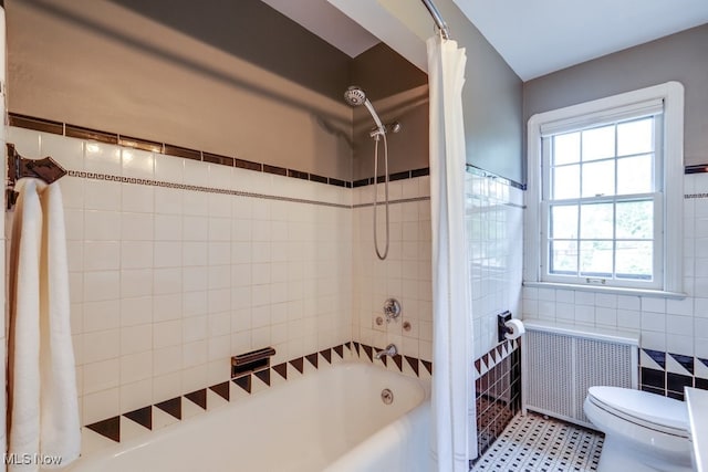 2500 Eaton Rd, University Heights, OH 44118 - full bath featuring radiator heating unit, tile walls, shower / bath combo with shower curtain, and toilet