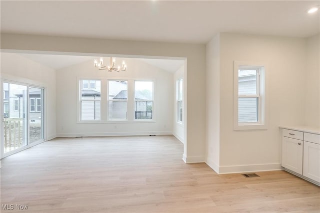 S/L12 Neptune Oval, Solon, OH 44139 - unfurnished dining area featuring a chandelier, light wood-style floors, baseboards, and lofted ceiling