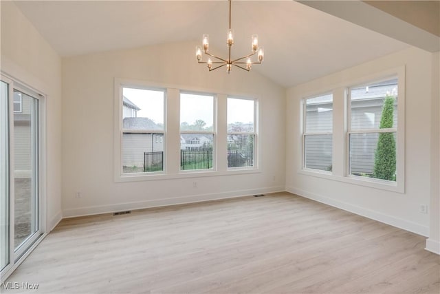 S/L12 Neptune Oval, Solon, OH 44139 - unfurnished dining area featuring a chandelier, healthy amount of natural light, light wood-style floors, baseboards, and vaulted ceiling