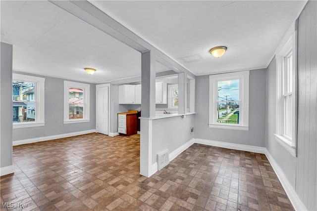 4611 W 41st St, Cleveland, OH 44109 - spare room with brick patterned flooring and baseboards