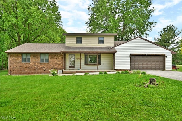 6416 Wilson Sharpsville Rd, Fowler, OH 44418 - traditional home featuring a porch, an attached garage, driveway, a front yard, and brick siding