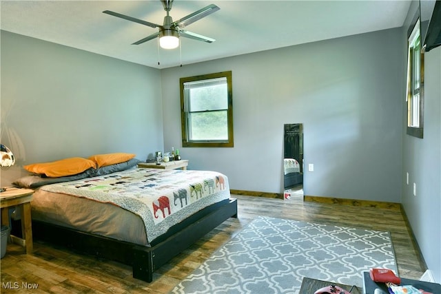 6416 Wilson Sharpsville Rd, Fowler, OH 44418 - bedroom featuring wood finished floors, baseboards, and ceiling fan