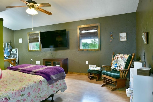 6416 Wilson Sharpsville Rd, Fowler, OH 44418 - bedroom featuring light wood finished floors, multiple windows, a textured wall, and lofted ceiling